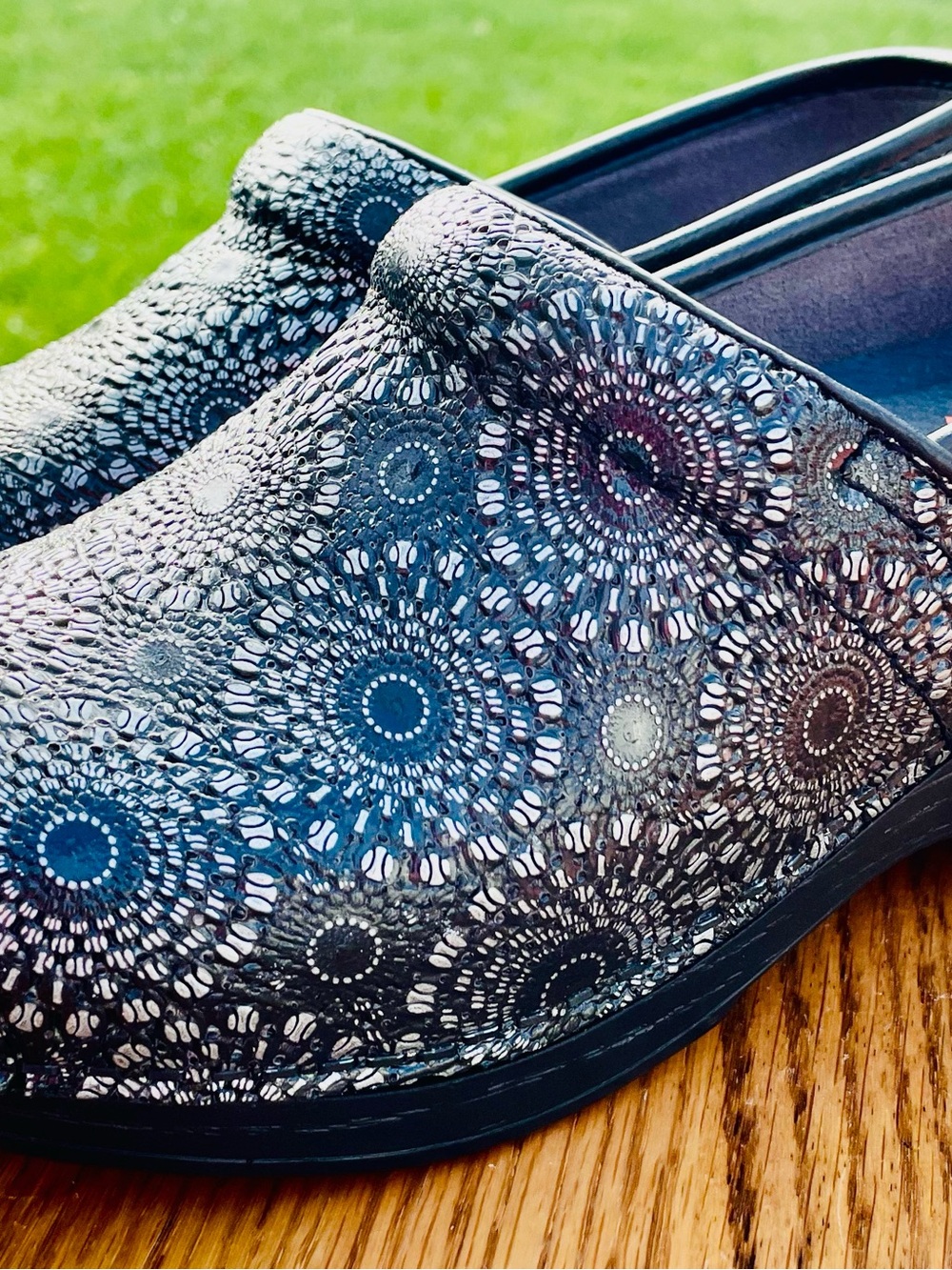 Dansko Women's Slip-On Clogs in Black Iridescent Medallion Pattern